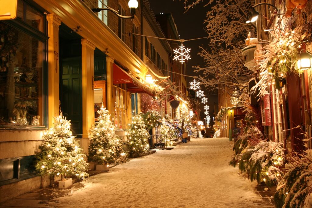 Glowing Yellow Christmas Lights And Trees On The Street